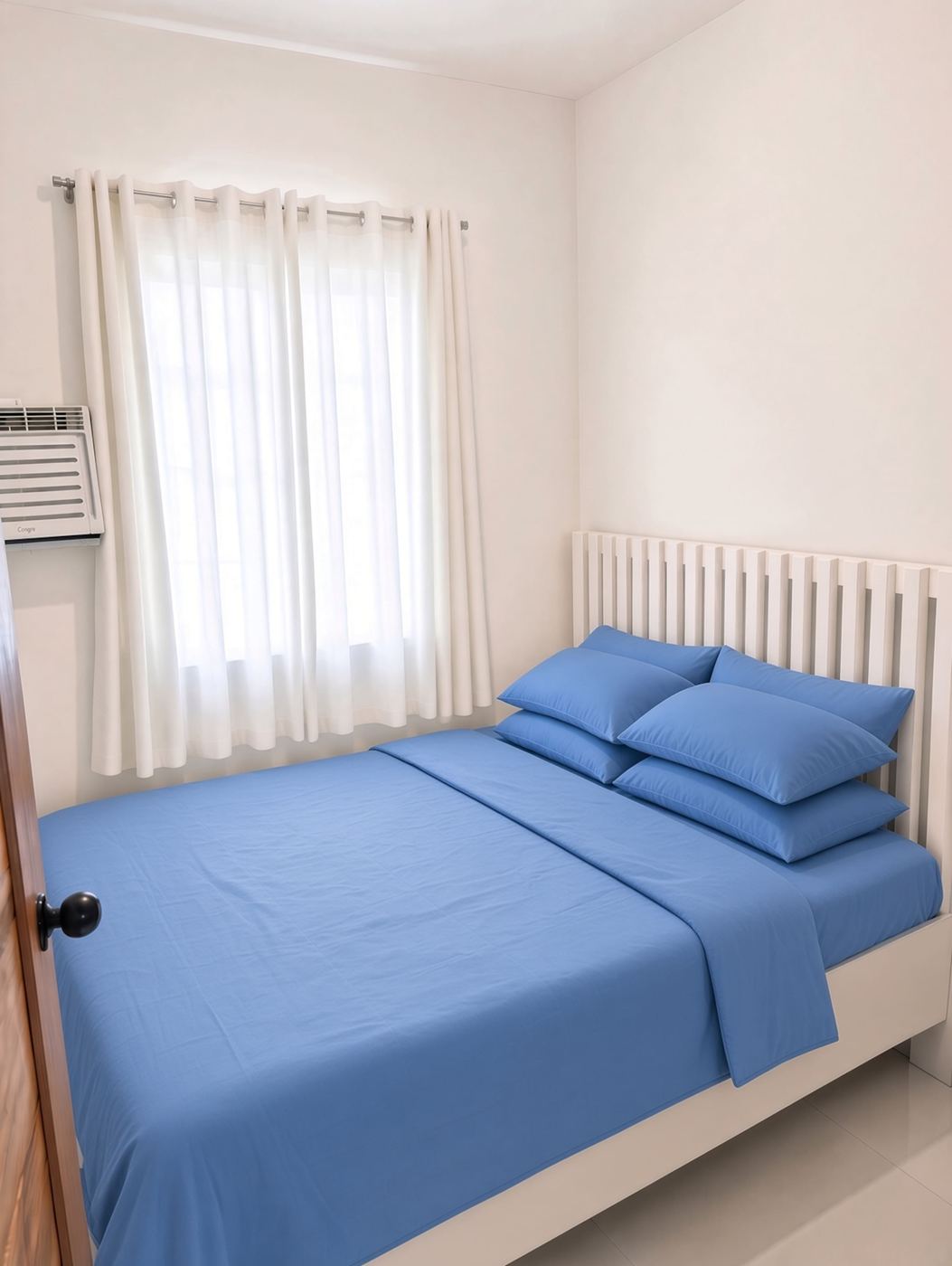 Bedroom 1 with queen bed and blue bedding