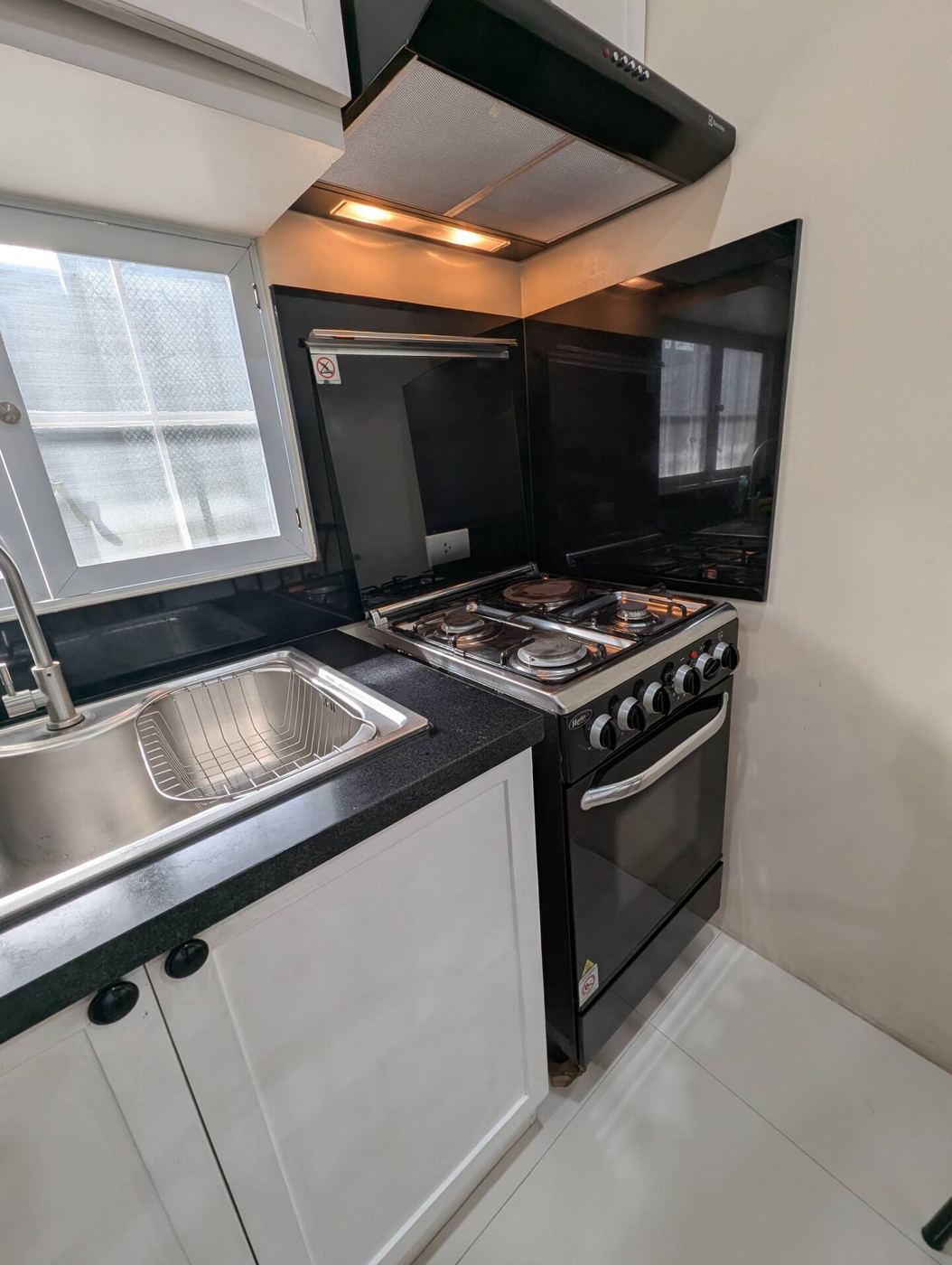Kitchen with gas range, oven and sink