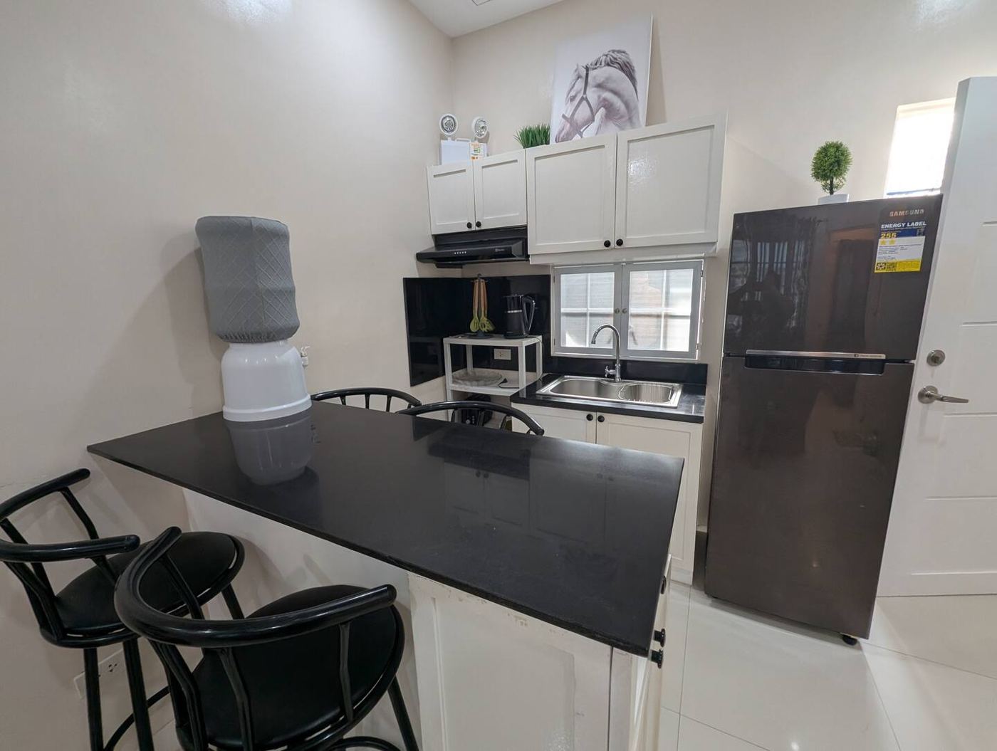 Breakfast bar with stools and refrigerator