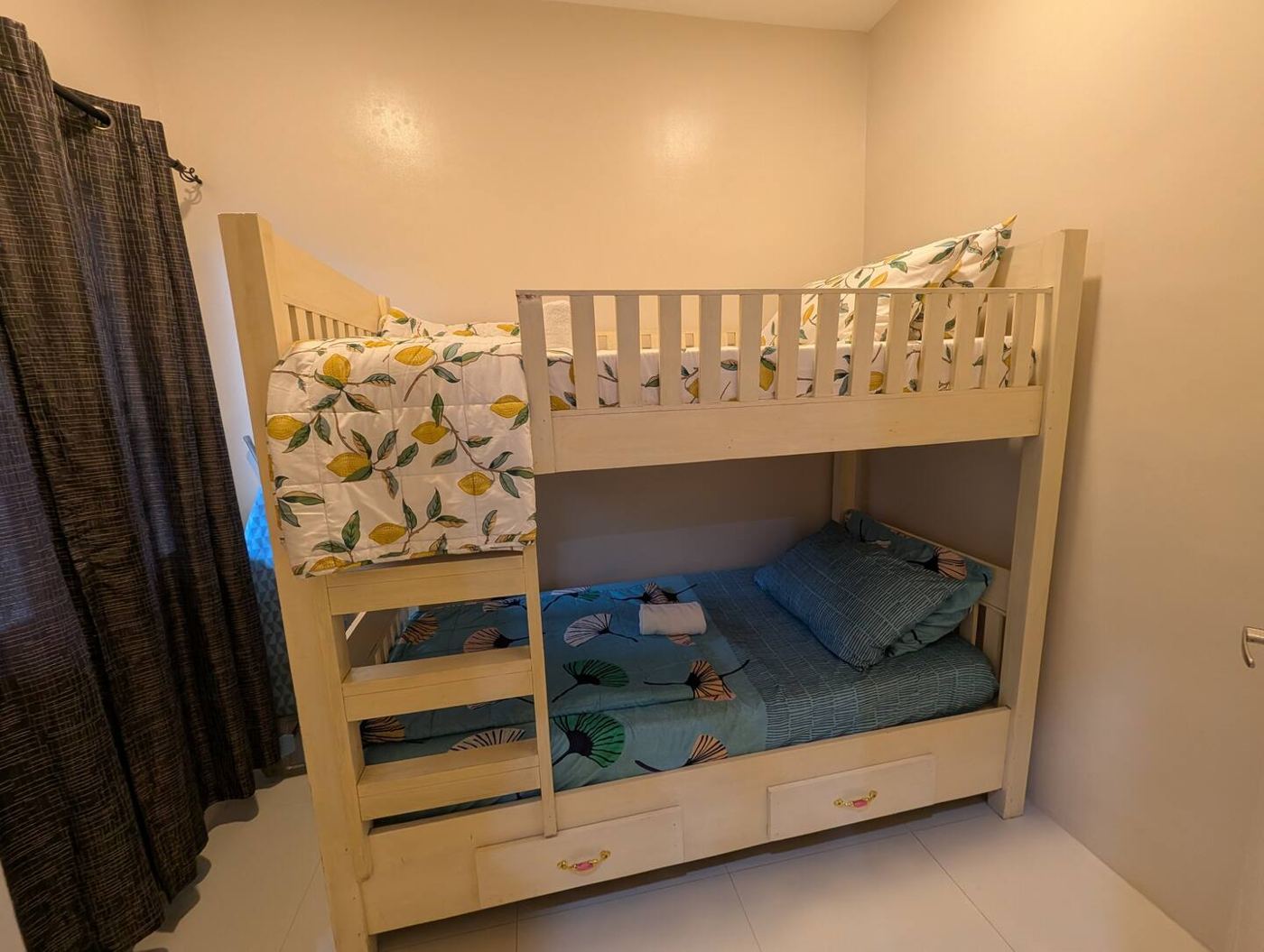 Second bedroom with light-wood bunk beds